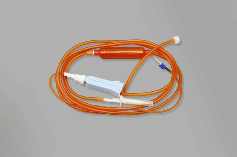 Disposable light shielded infusion set with needle
